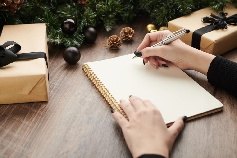 Woman Writing Wish List of Presents
